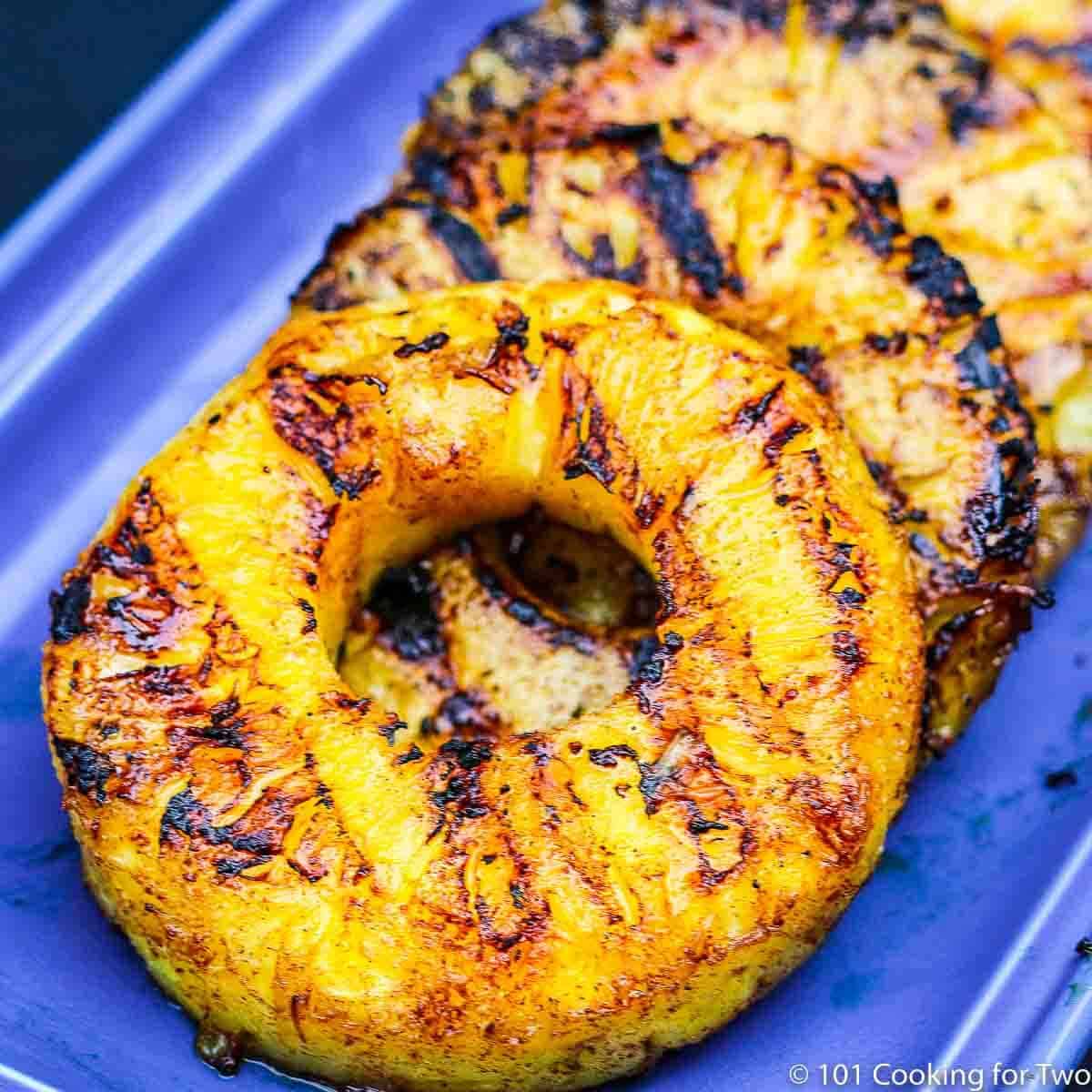 grilled pineapple on blue plate