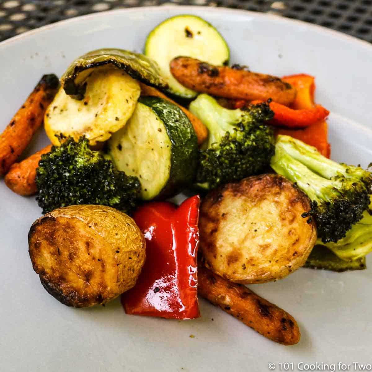 grilled vegetables on gray plate.