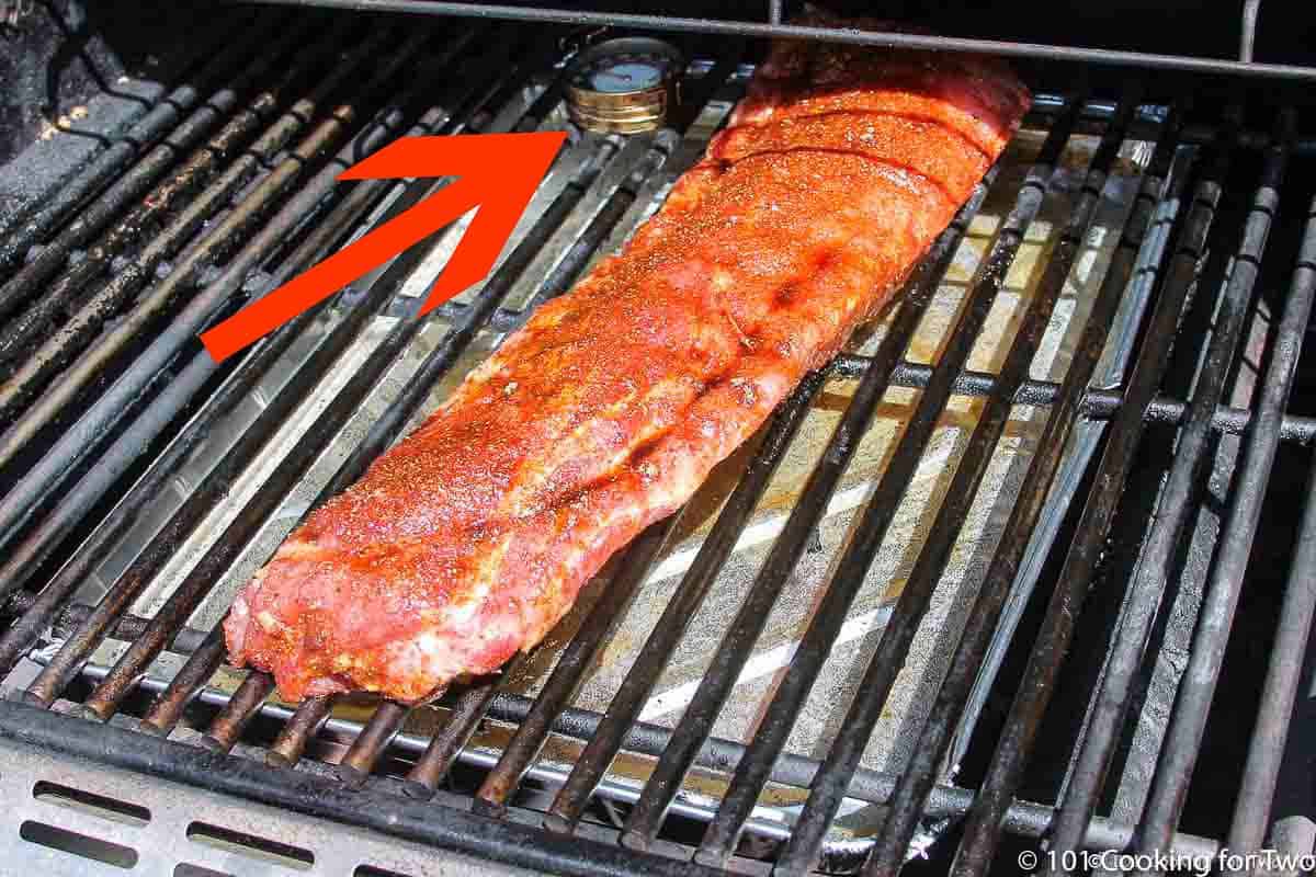 ribs on grill with thermometer.