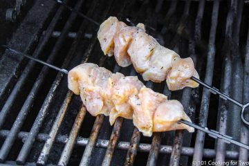 two chicken kabobs on grill