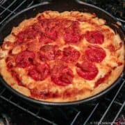 whole cook biscuit crust pizza in pan on rack