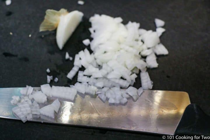 chopped onion on black board
