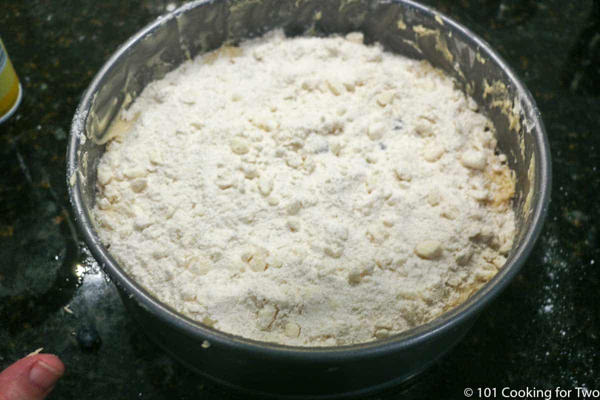 flour mixture on the top of the cake