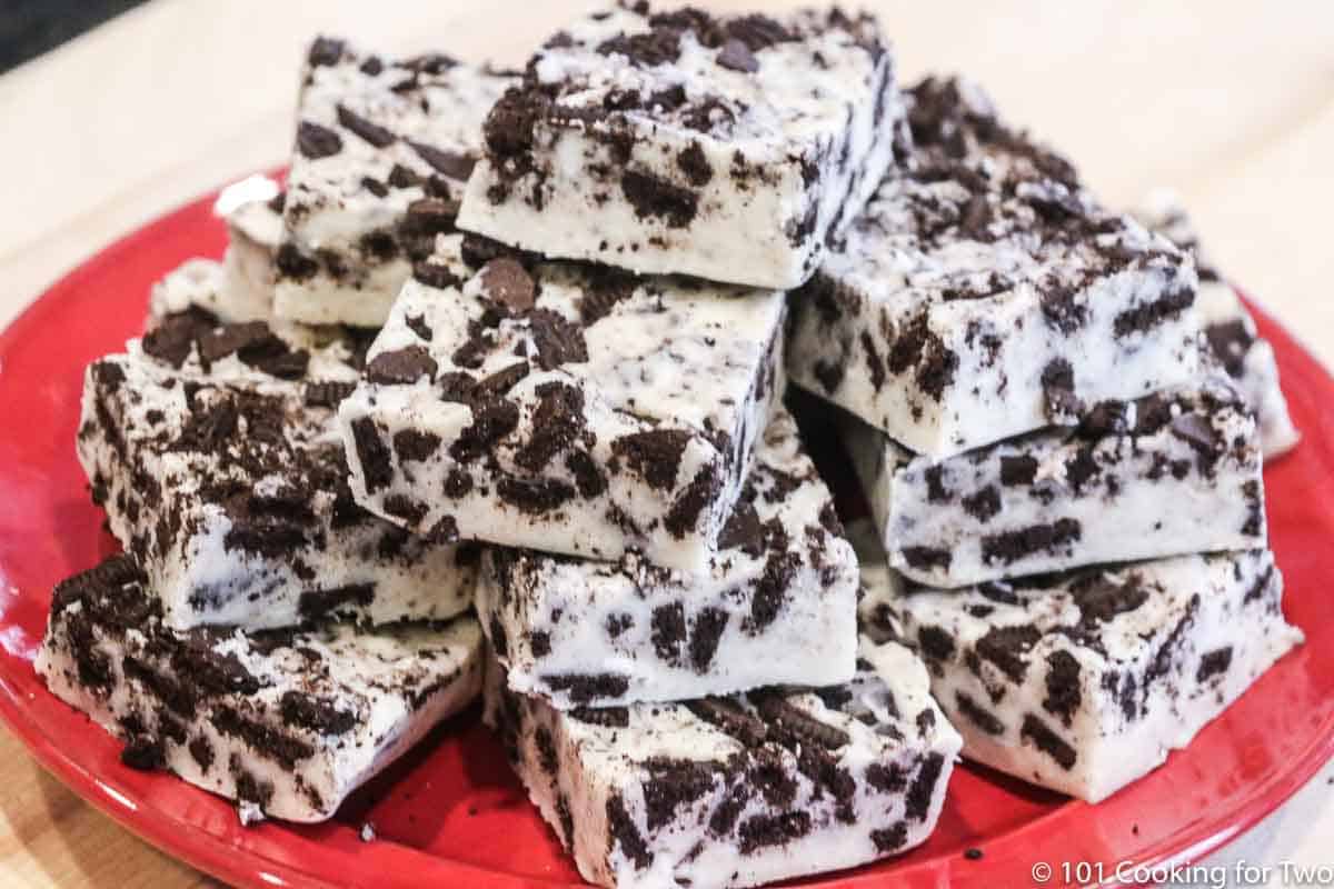 pile of oreo fudge on a red plate.