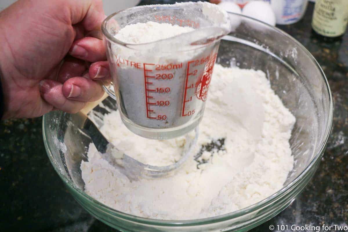 removing one cup of flour mixture from bowl