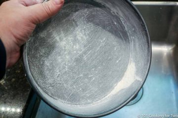 round baking pan coated with flour