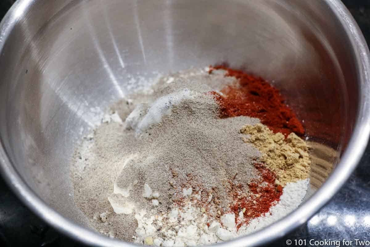 flour with spices in metal bowl.