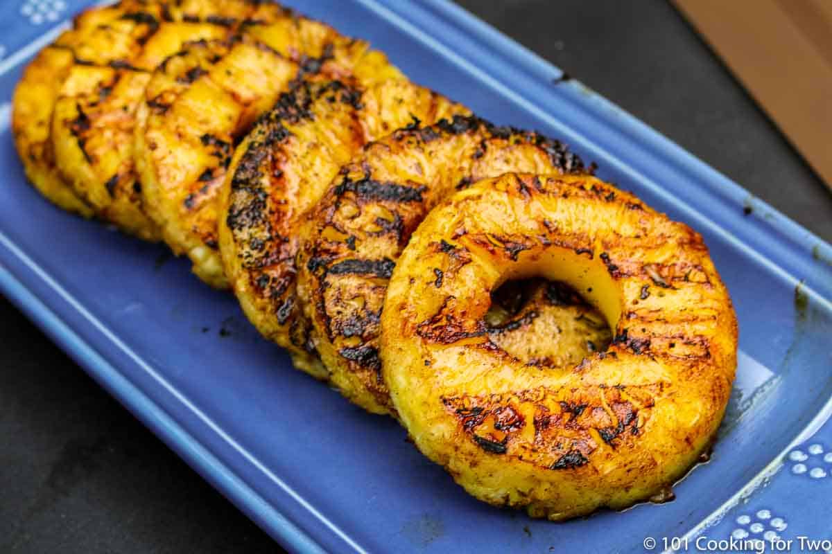 grilled pineapple on blue plater