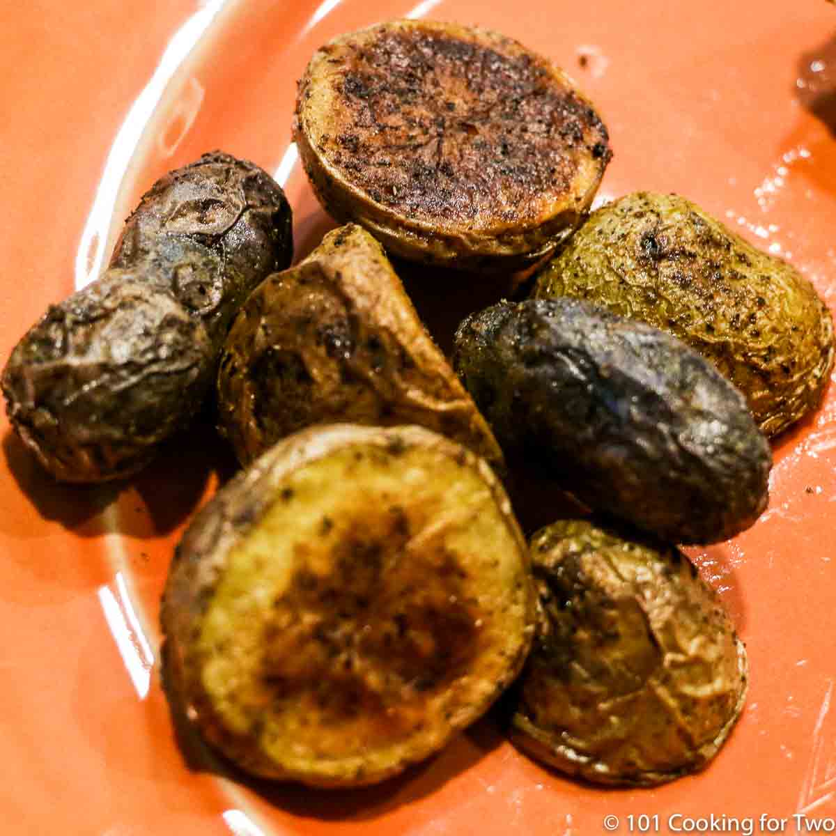 grilled potatoes on an orange plate