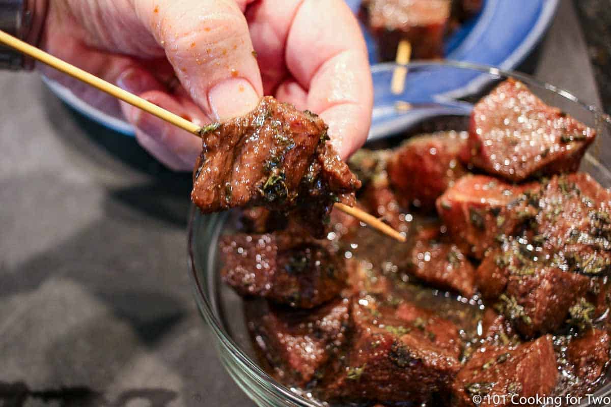 Place steak on skewers.