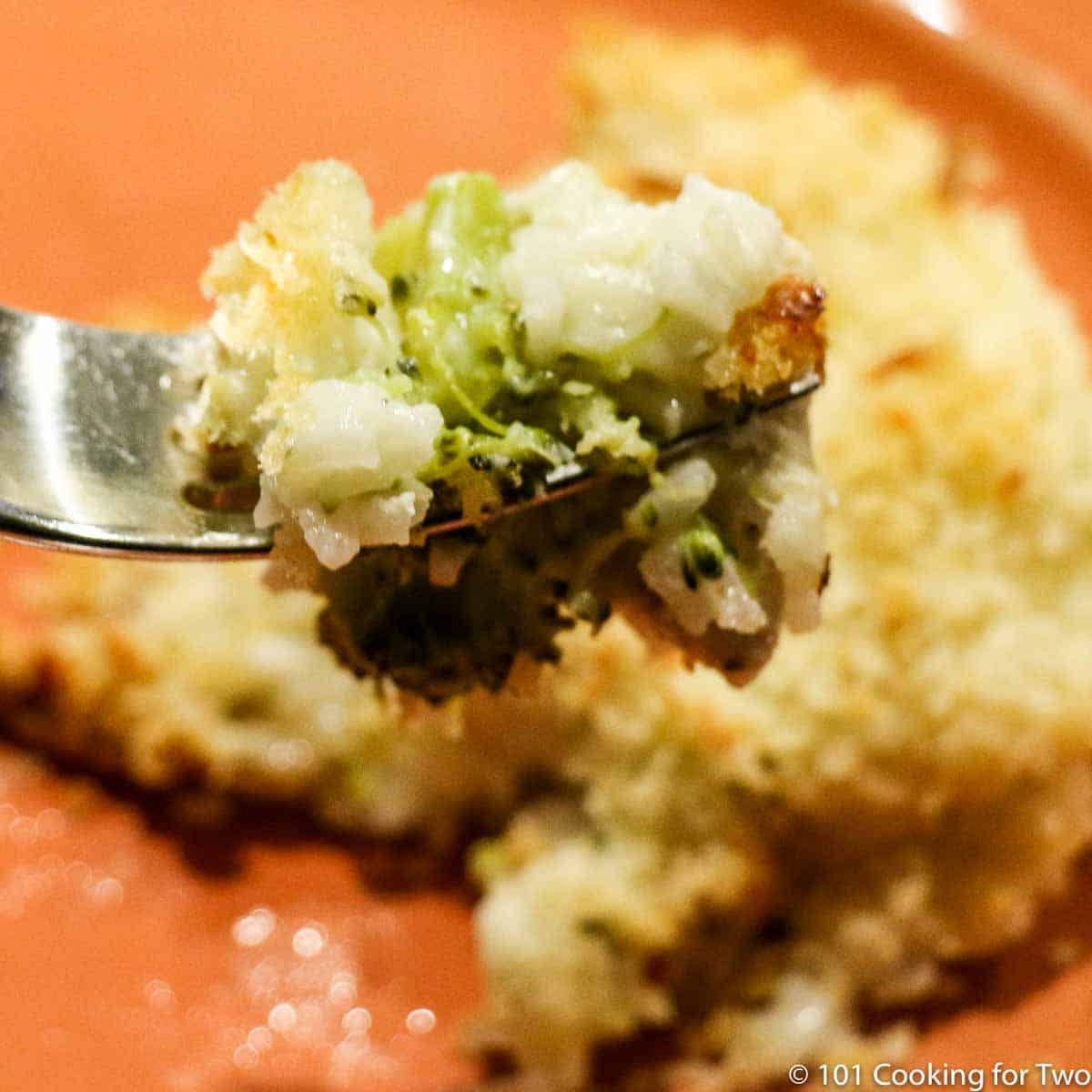 Chicken broccoli rice casserole on a fork