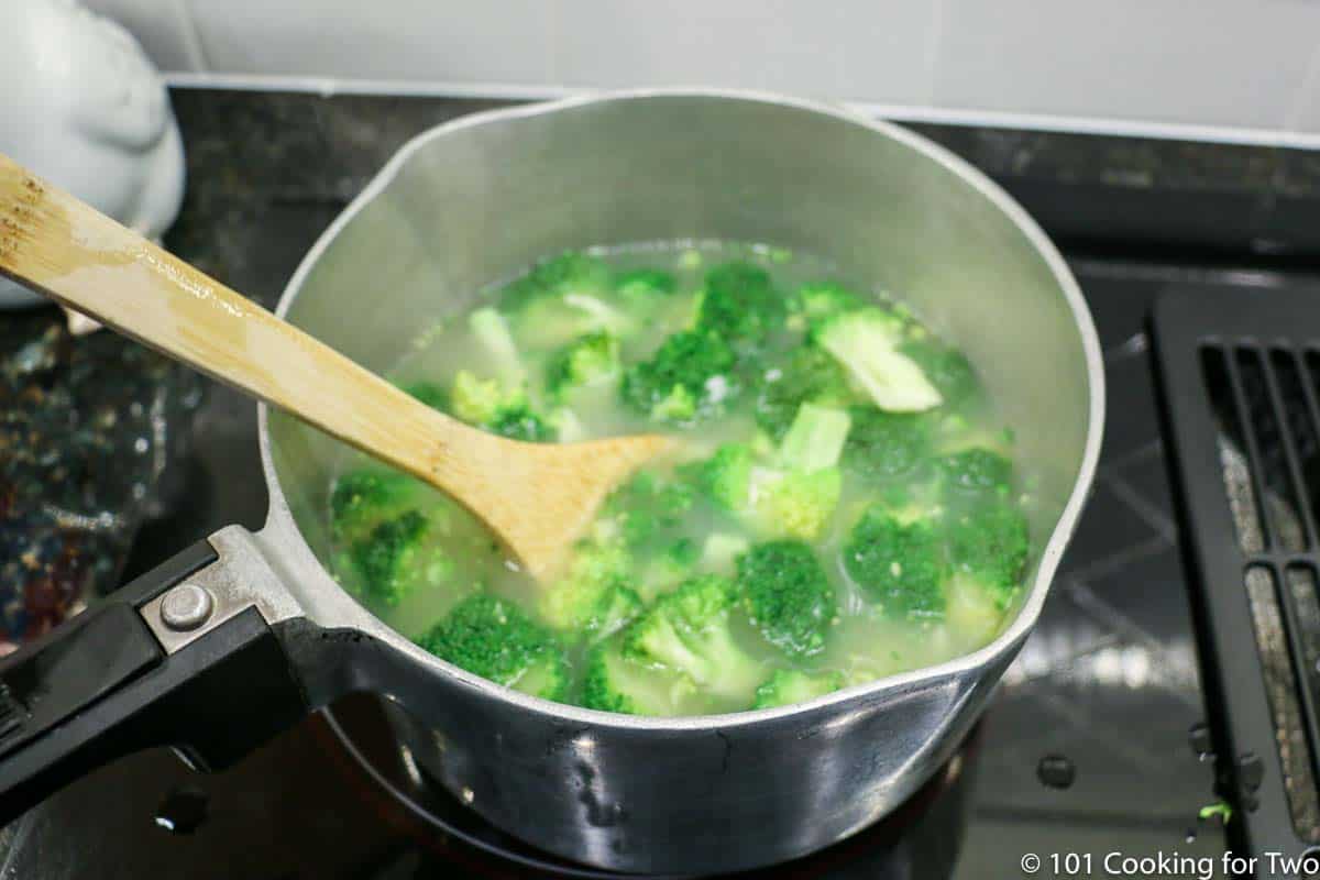 cooking broccoli in sauce pan.