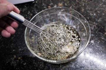 Mix the beef kabob marinade in a bowl with a whisk.