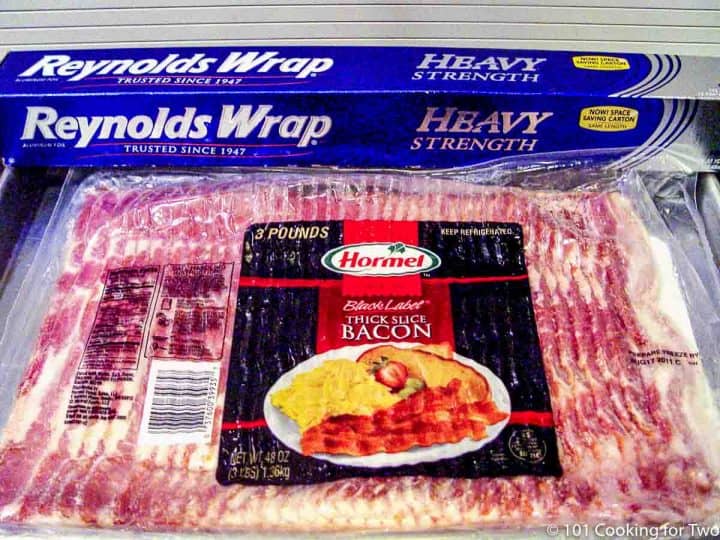 package of raw bacon and foil