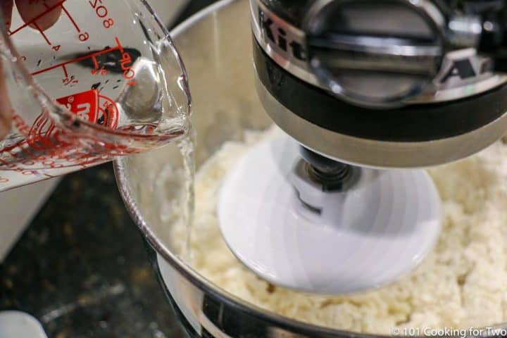 pouring water into stand mixer bowl