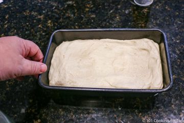 raw dough in a loaf pan