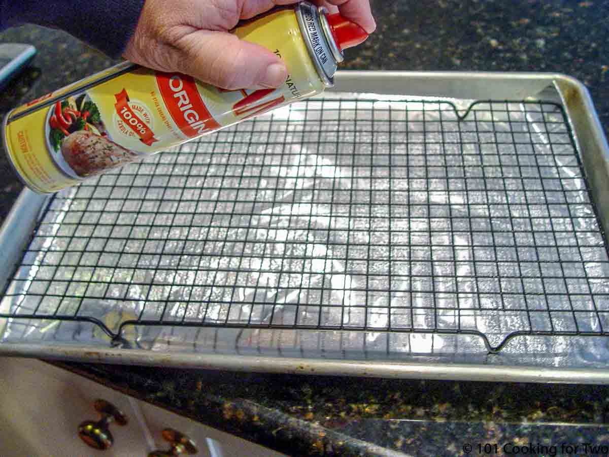 spary rack on tray and foil with PAM cooking spray.
