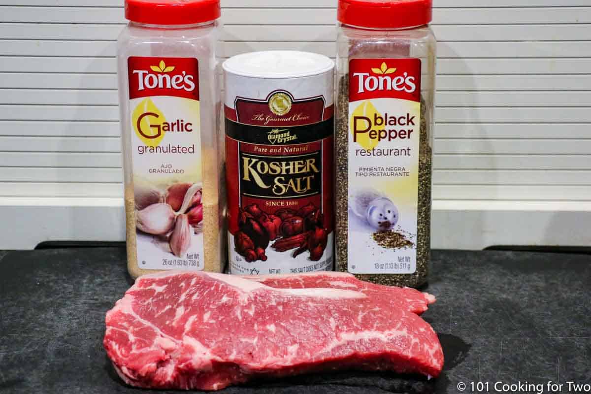 strip steaks with seasonings.