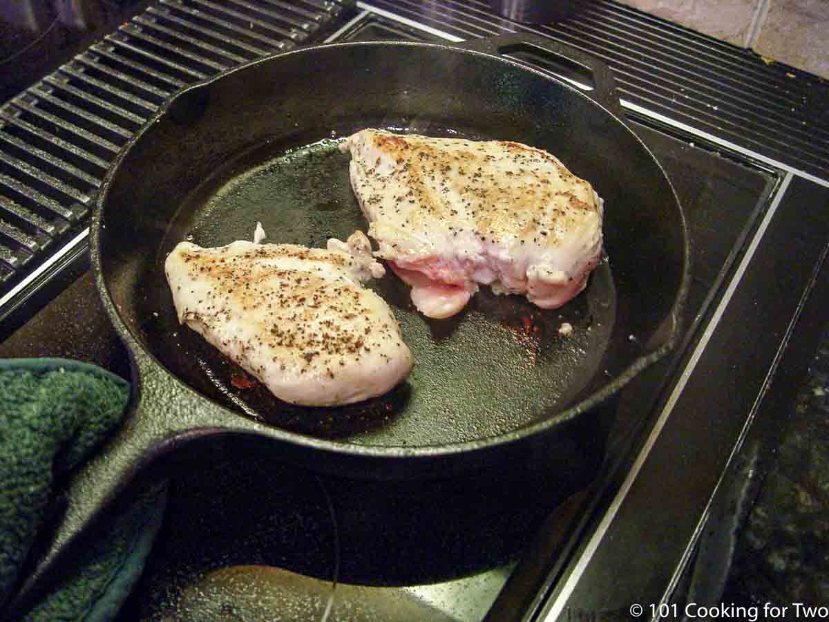 Browned chicken breast to a cast iron skillet_
