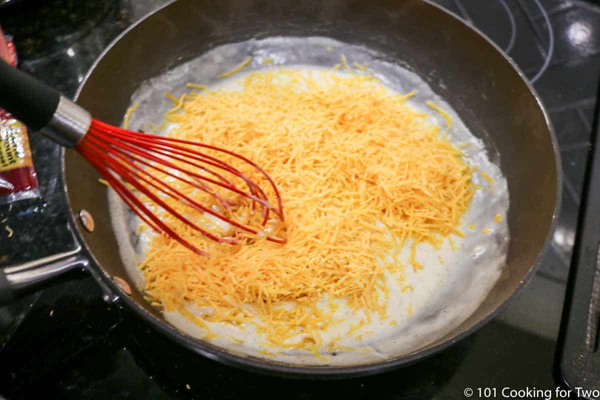 adding cheese to pan with a roux