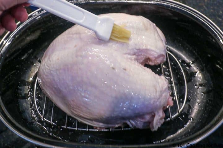 brushing turkey breast with oil