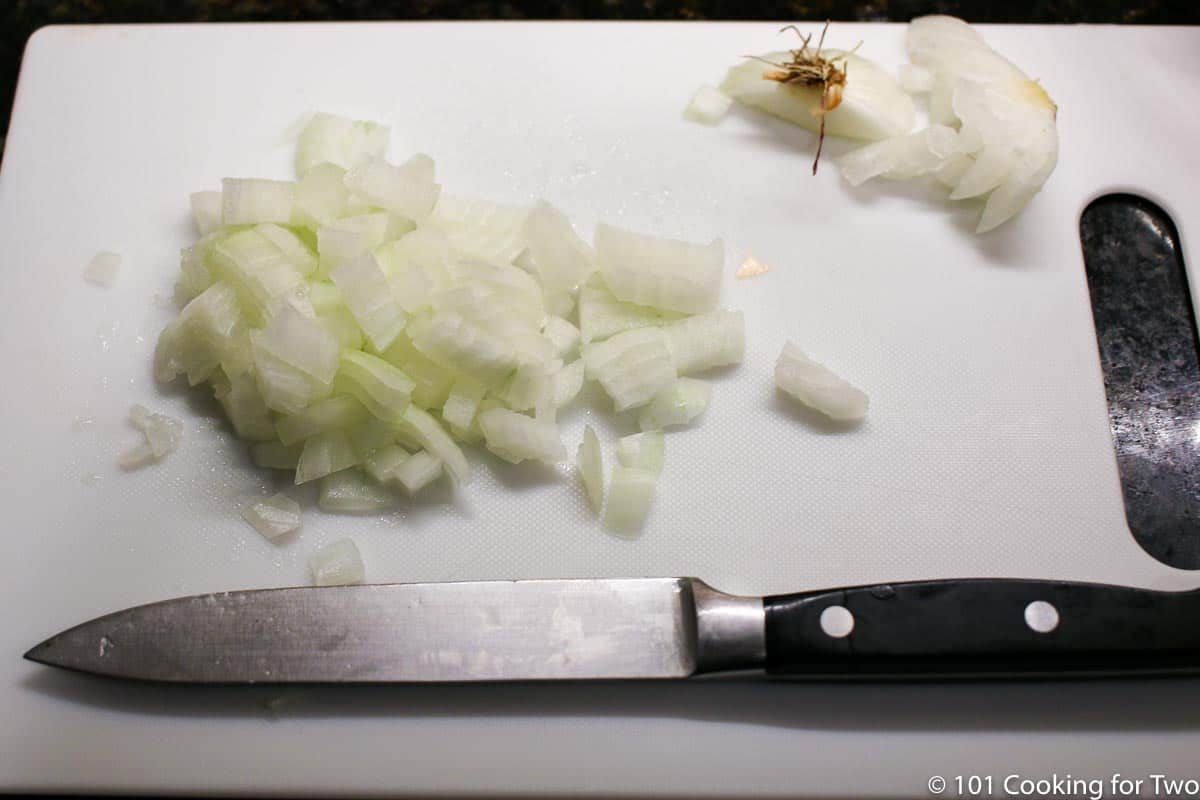 chopped onion on a chipping board