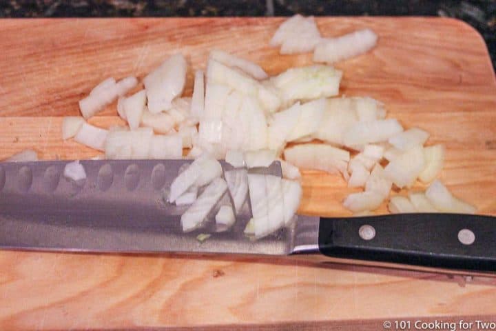 chopped onion on wooden board