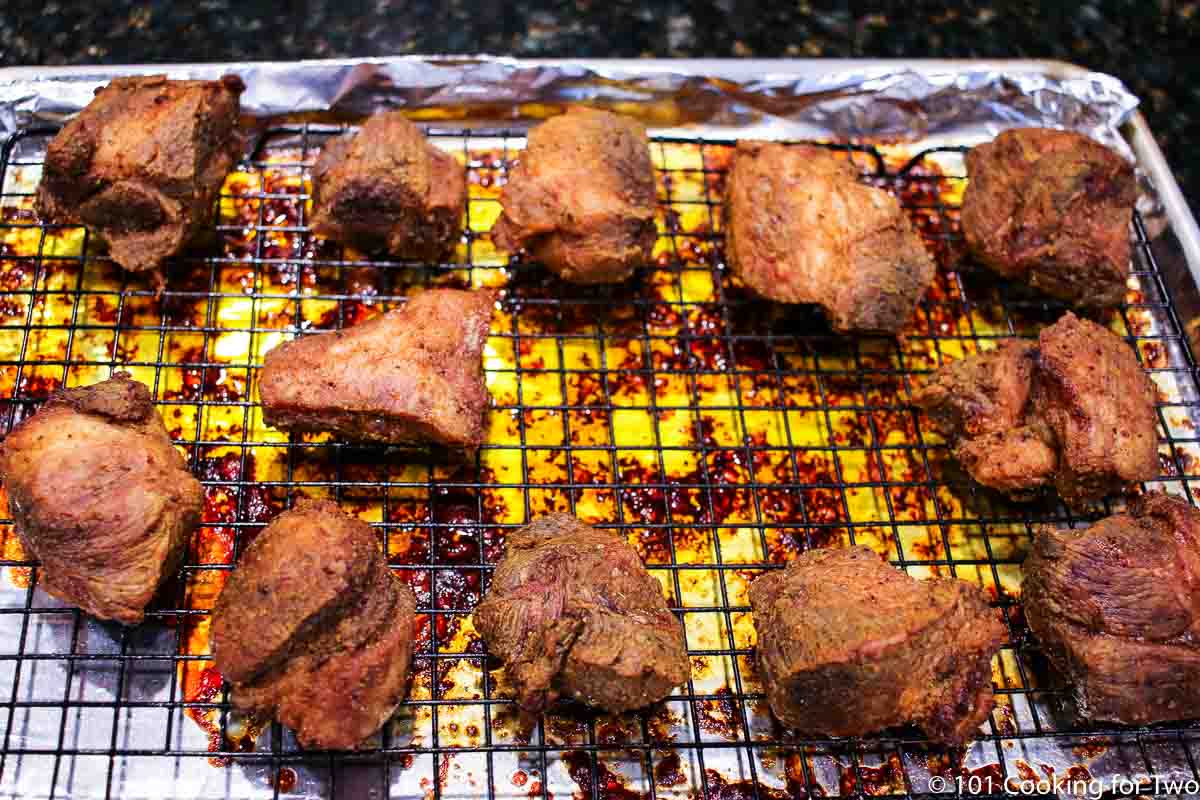 cooked carnitas still on the rack.