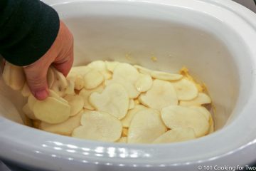 layering slices of potato into crock pot