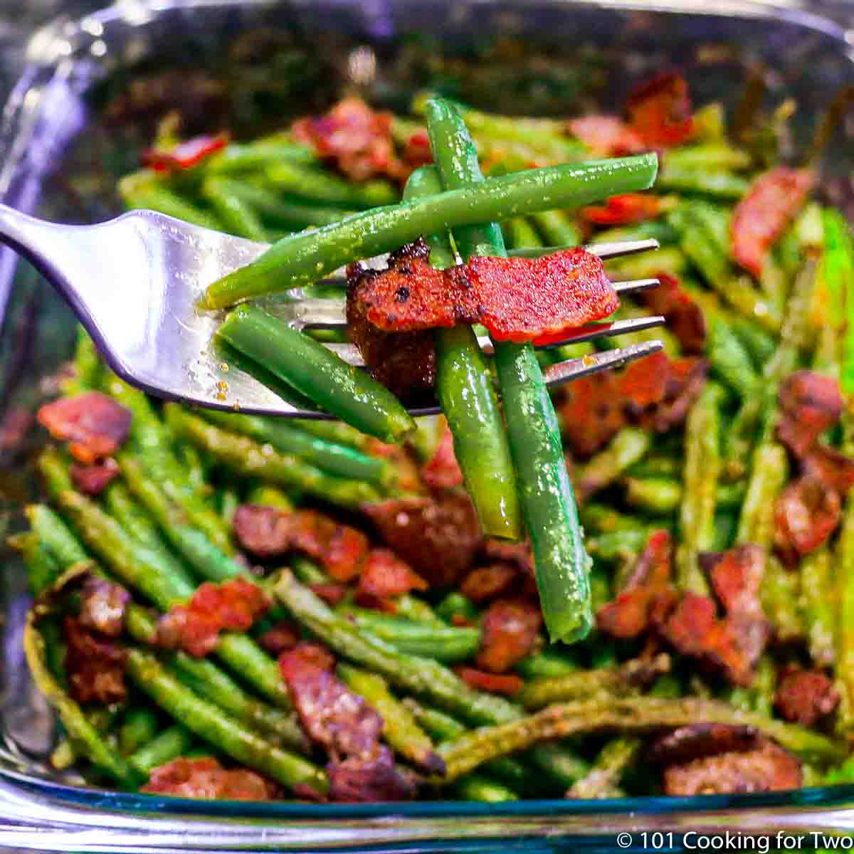 green beans with bacon on a fork