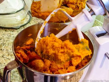 mixing cooked sweet potatoes in a stand mixer