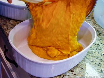 pouring sweet potato into casserole bowl