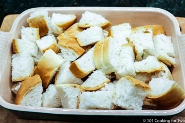 cubes of bread in a small casserole dish