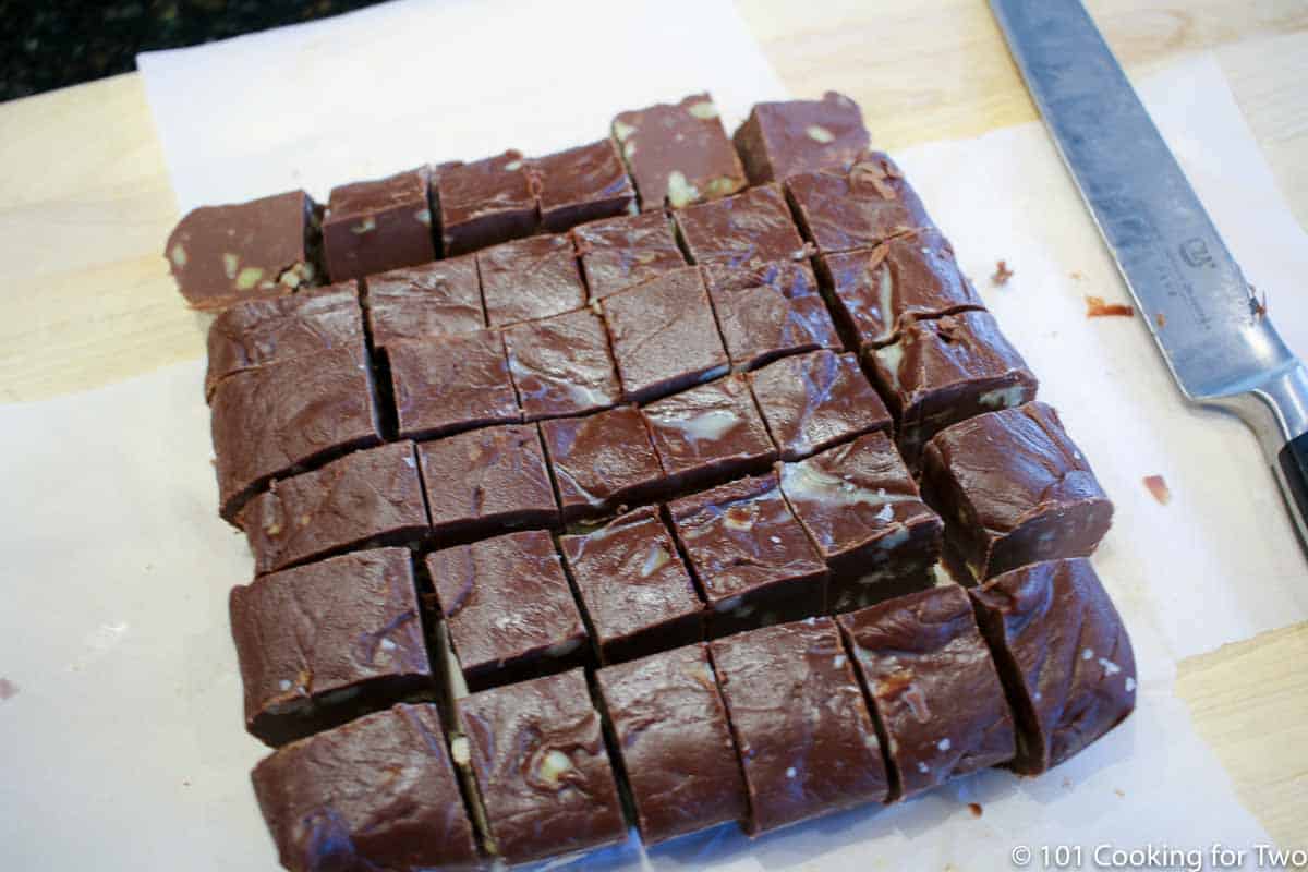 fudge cut into small cups on the parchment paper