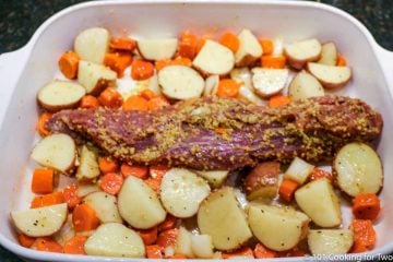 pork tenderloin with veggies in baking dish raw