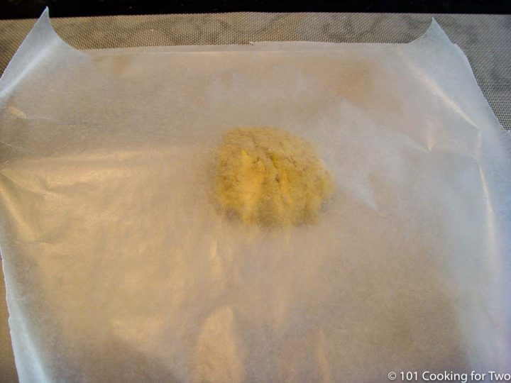 ball of dough covered with wax paper