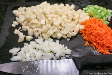 chopped vegetables on a black board