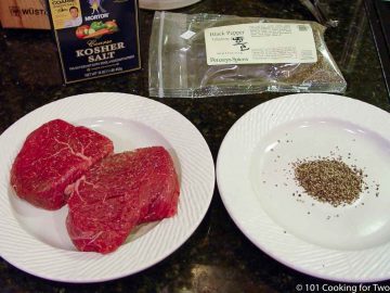filets and pepper on two white plates