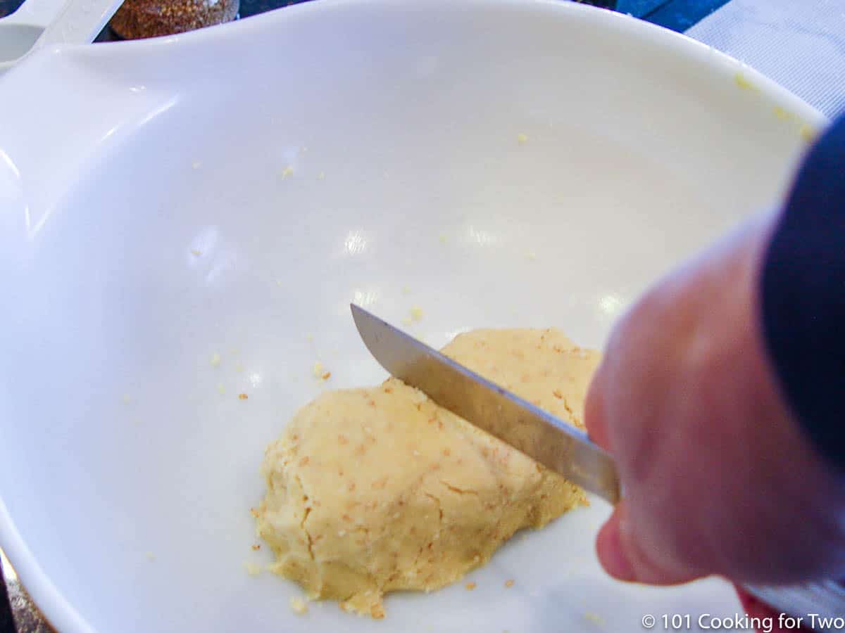 form the dough into a ball and cut in half