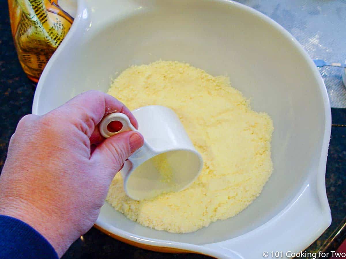 mixing soy flour with Parmesan.