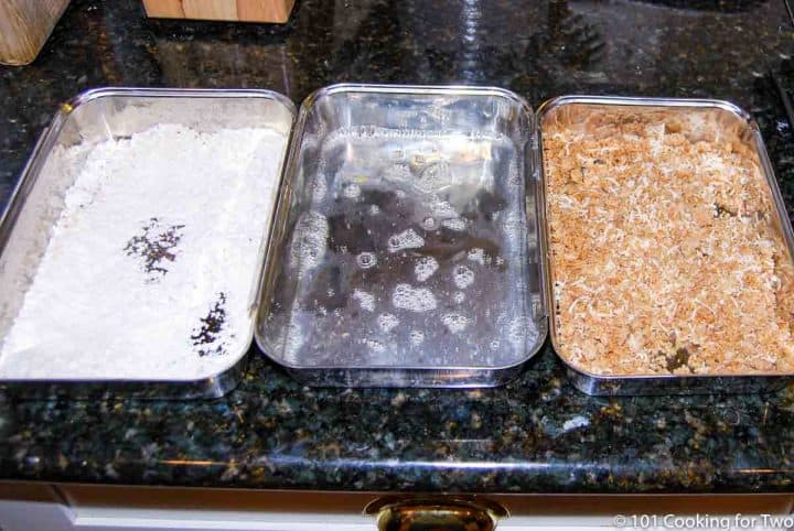 pans of flour with egg and bread curmbs for topping