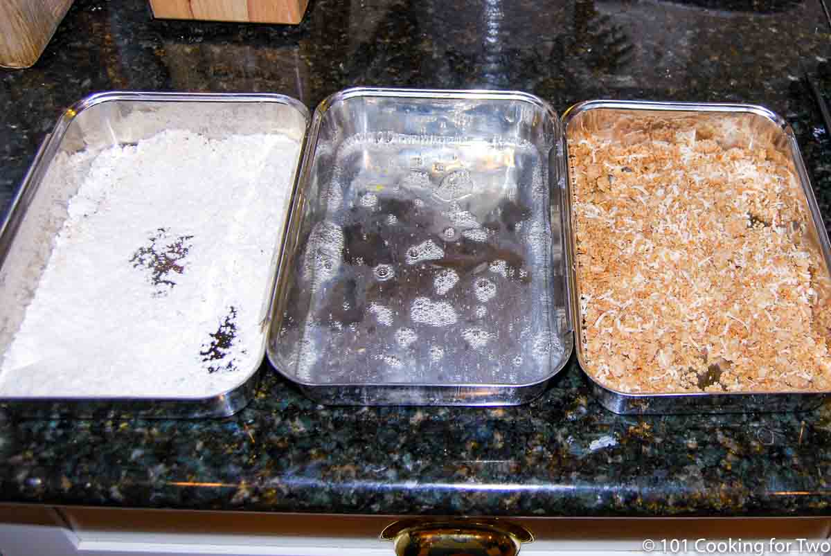 pans of flour with egg and bread curmbs for topping.