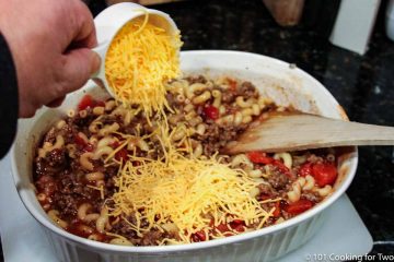 adding cheese on the casserole