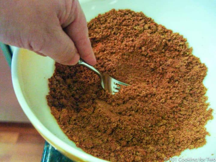 mixing brown sugar with spices in bowl