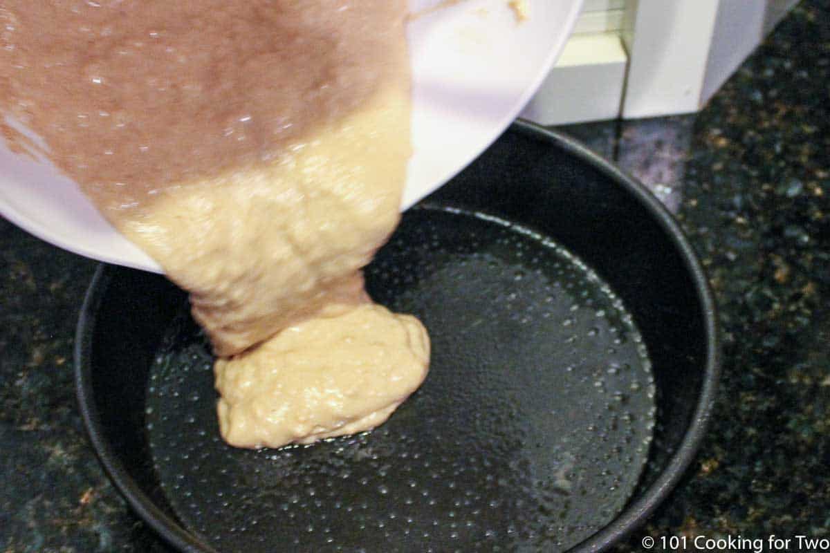 pouring batter into prepared pan.