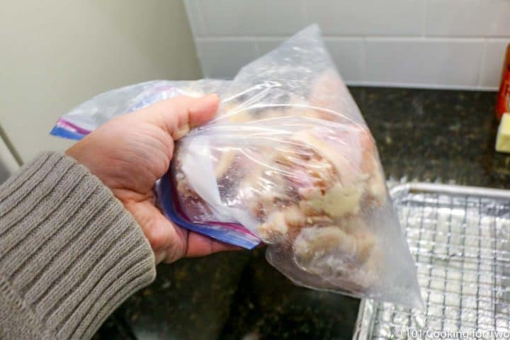 shaking wings in plastic bag to coat