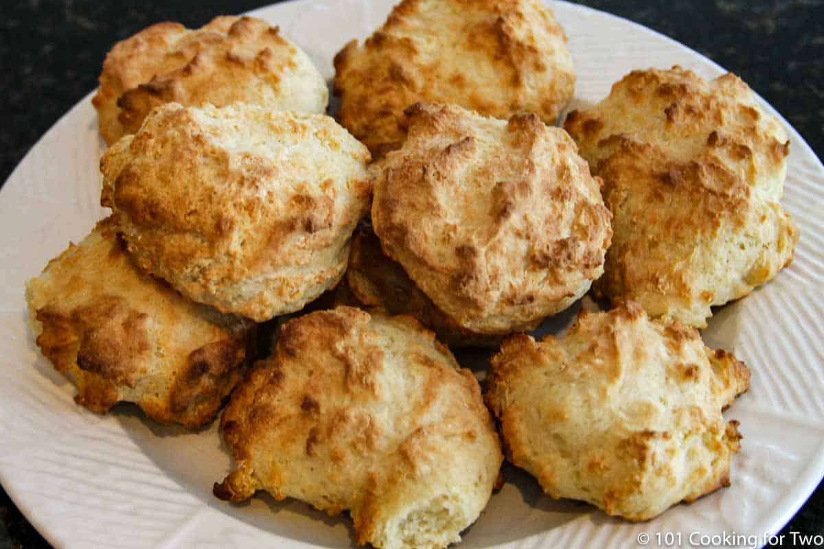 pile of drop biscuits on a white plate