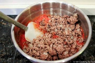 adding cooked meat to the sauce