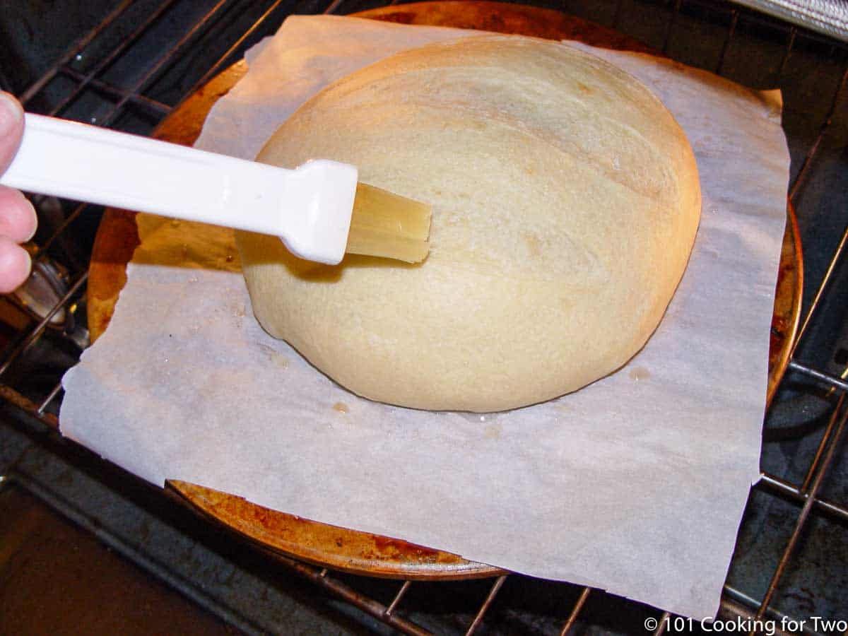 brushing the loaf with water during the baking.