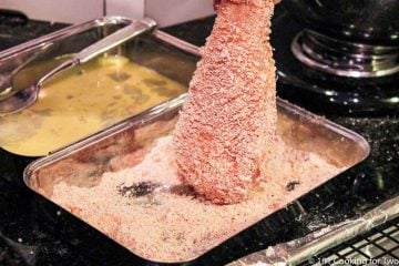 dipping chicken breast in the final coating